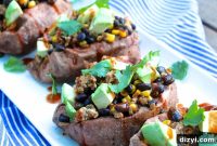 Enchilada Stuffed Sweet Potatoes with Melted Cheese