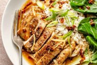 Seared Chicken Thighs in Garlic Ginger Broth over Rice