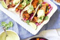 Crispy Baja Fish Tacos with Mango Coleslaw and Avocado Crema