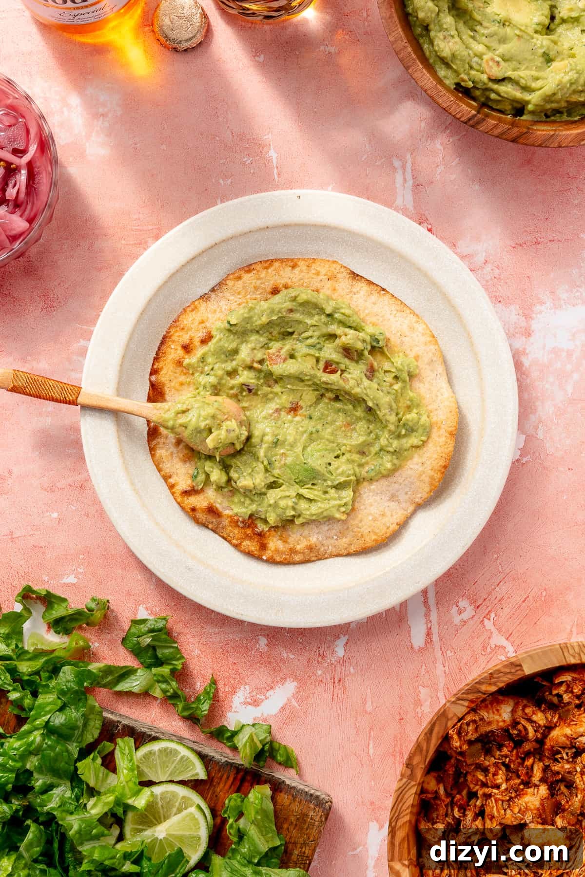 Tostada with guacamole spread on it.