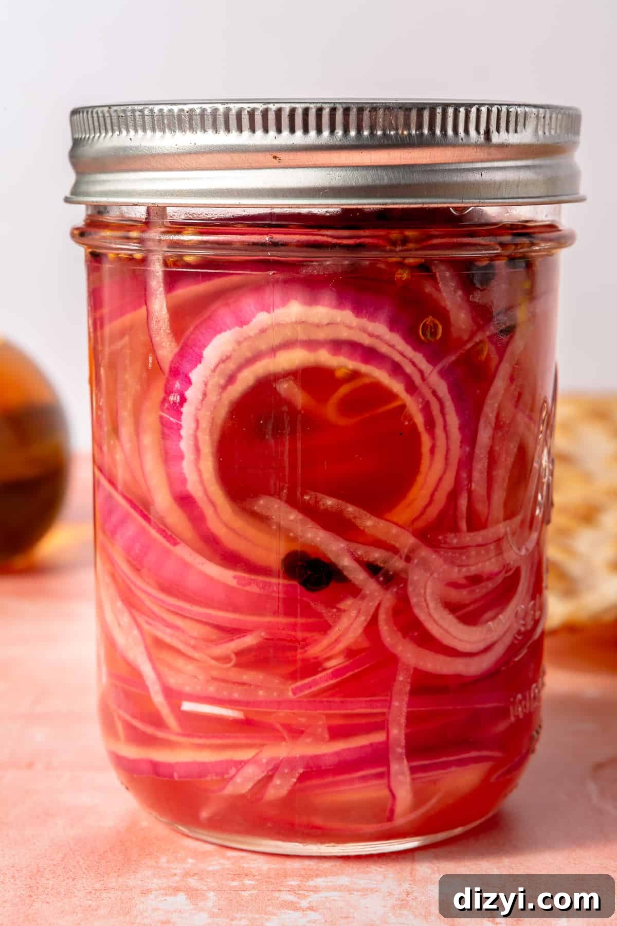 Quick pickled onions in mason jar.