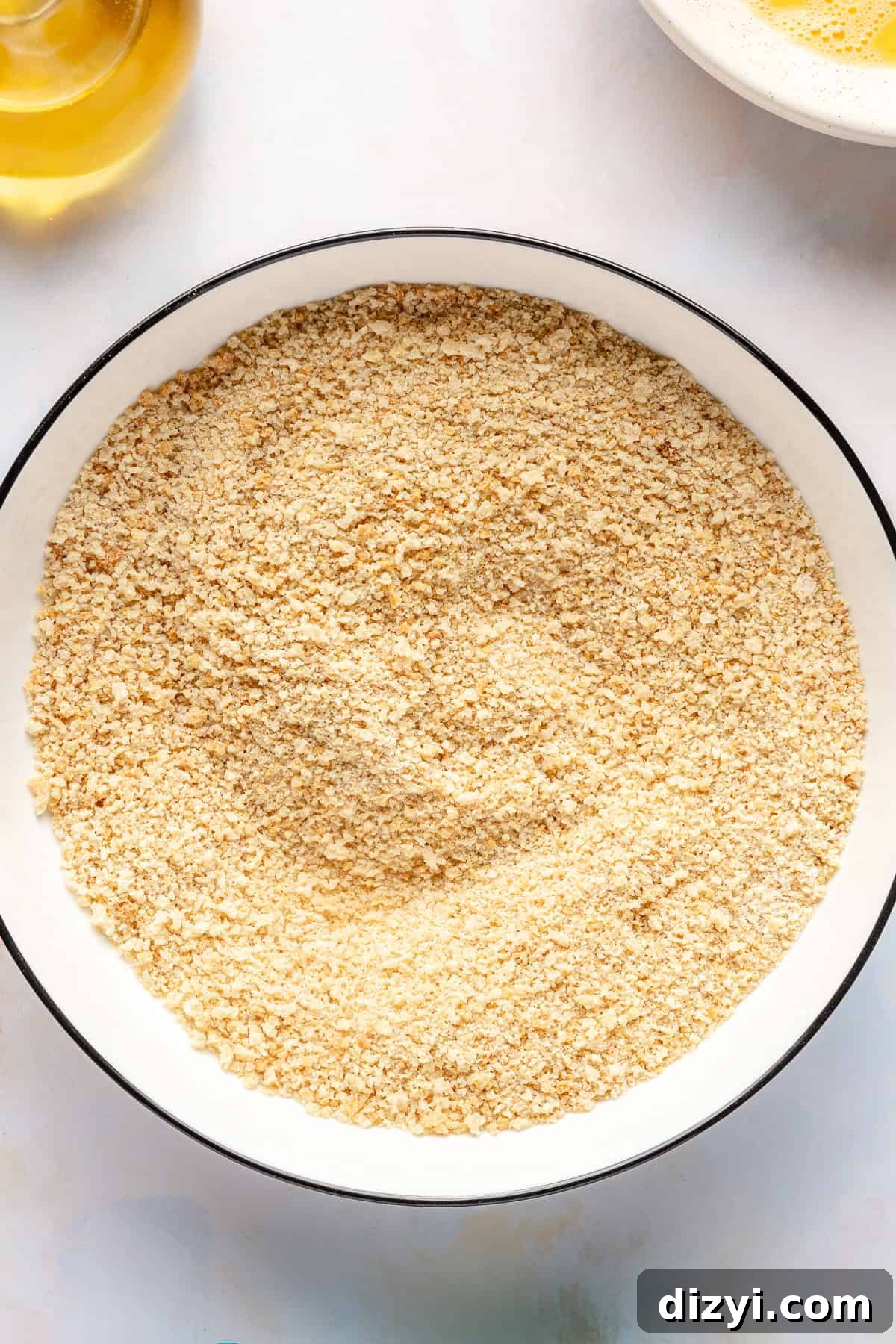 Cassava-panko mixture in low white bowl.