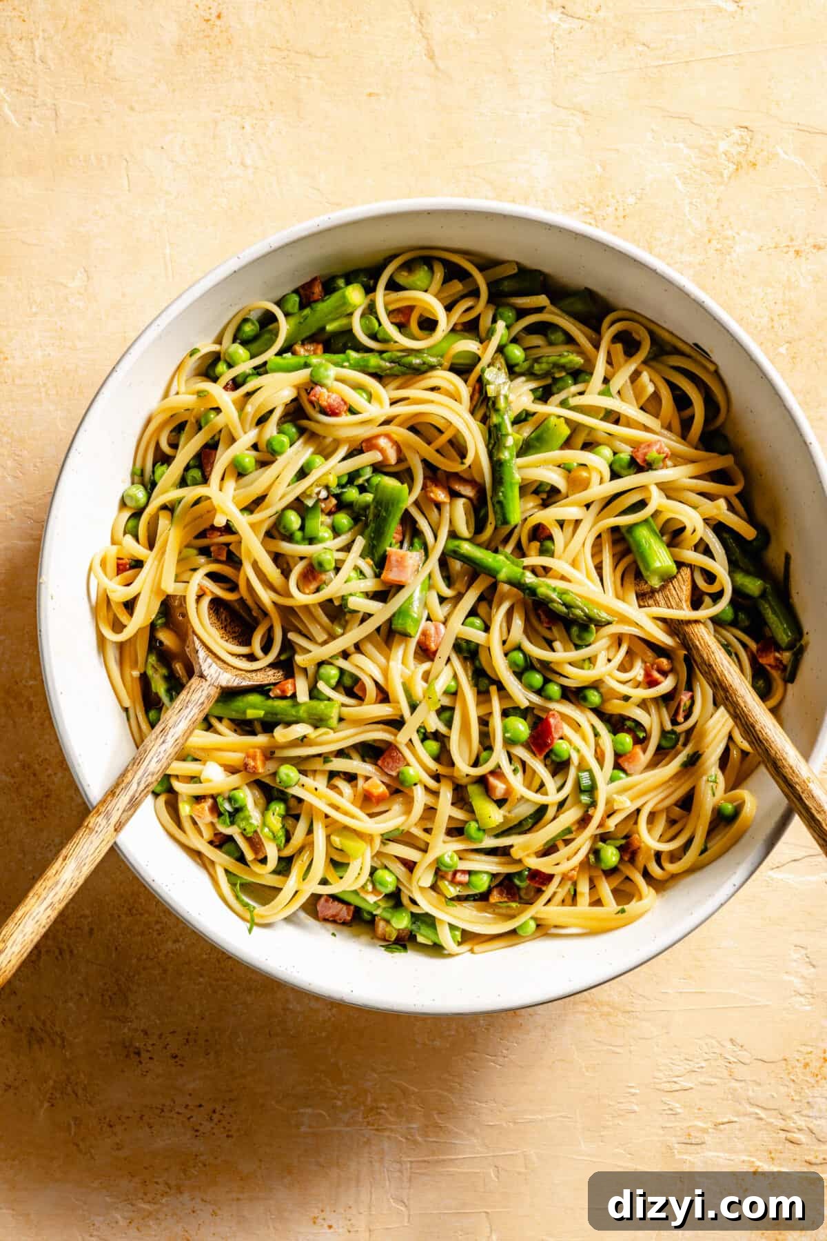 Spring Spaghetti Carbonara in white skillet.