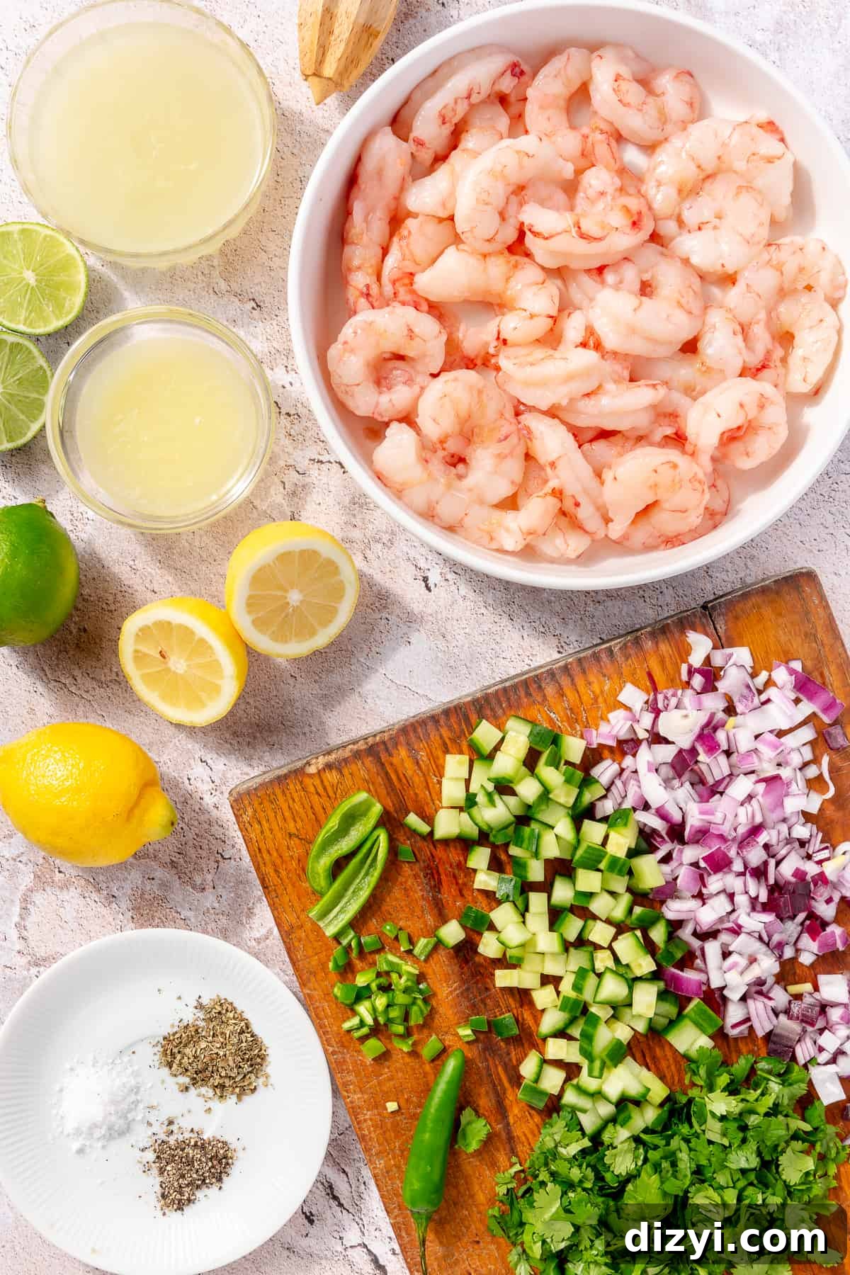 Shrimp Ceviche ingredients on counter in bowls and on cutting boards.
