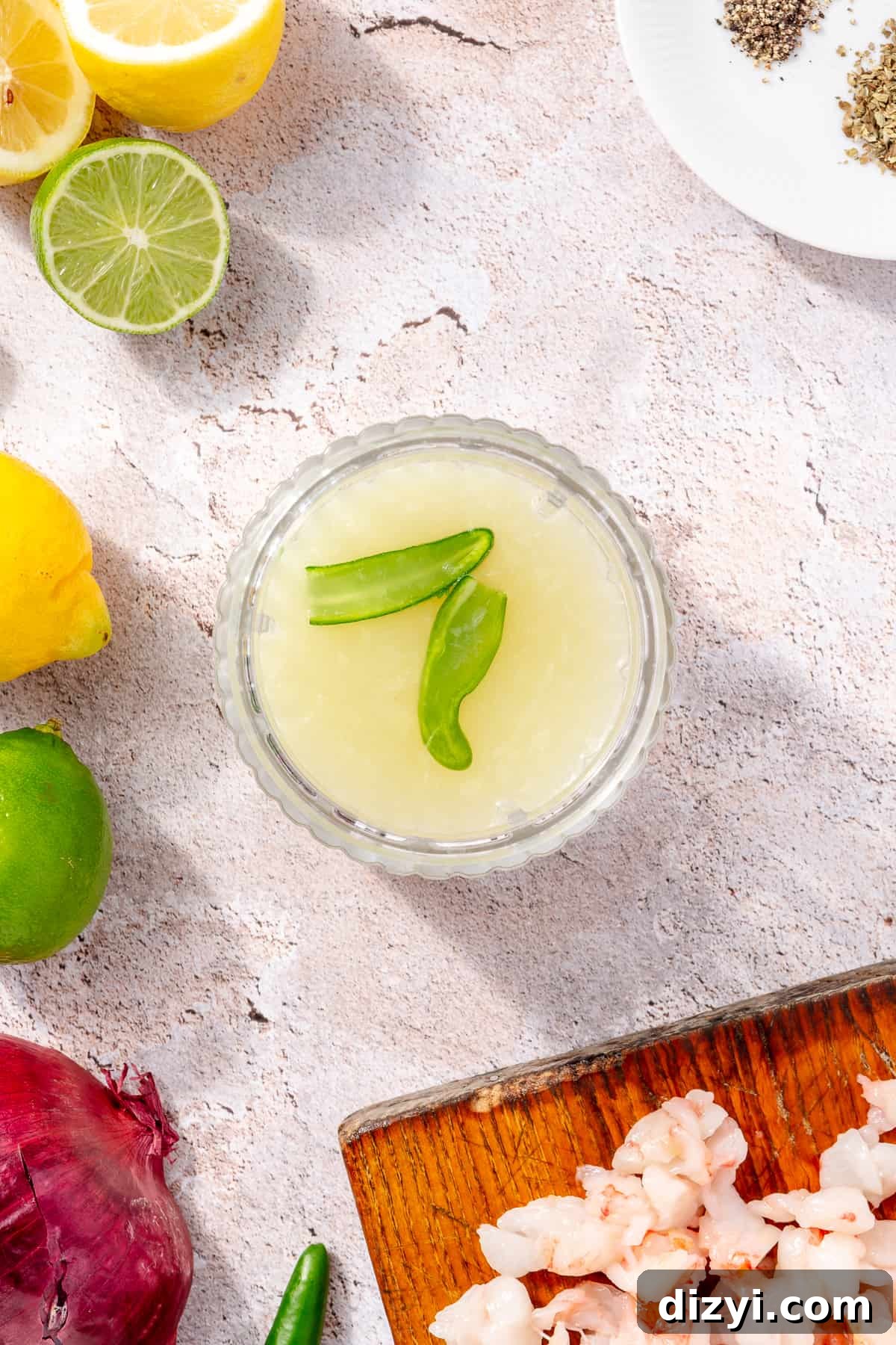 Lime juice in processor with whole serrano pepper.