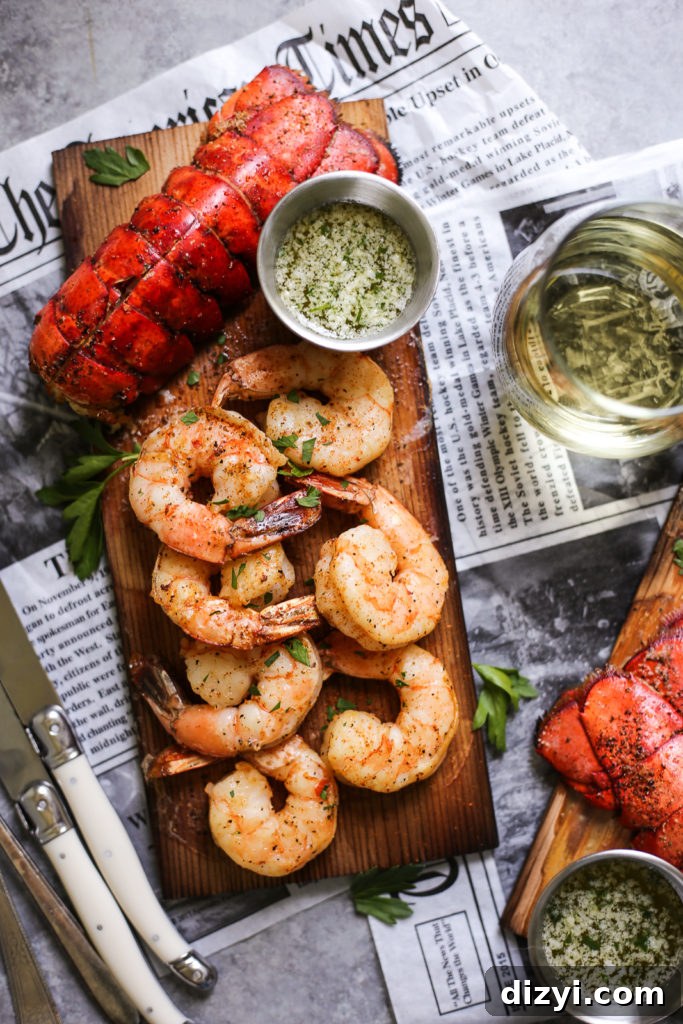 Plated cedar plank lobster and shrimp with garlic-herb butter