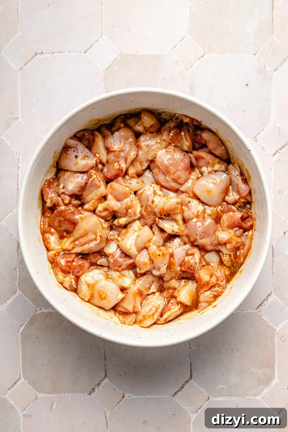 a bowl of marinated chicken thighs