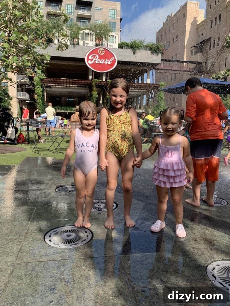 Children at the splash pad in The Pearl