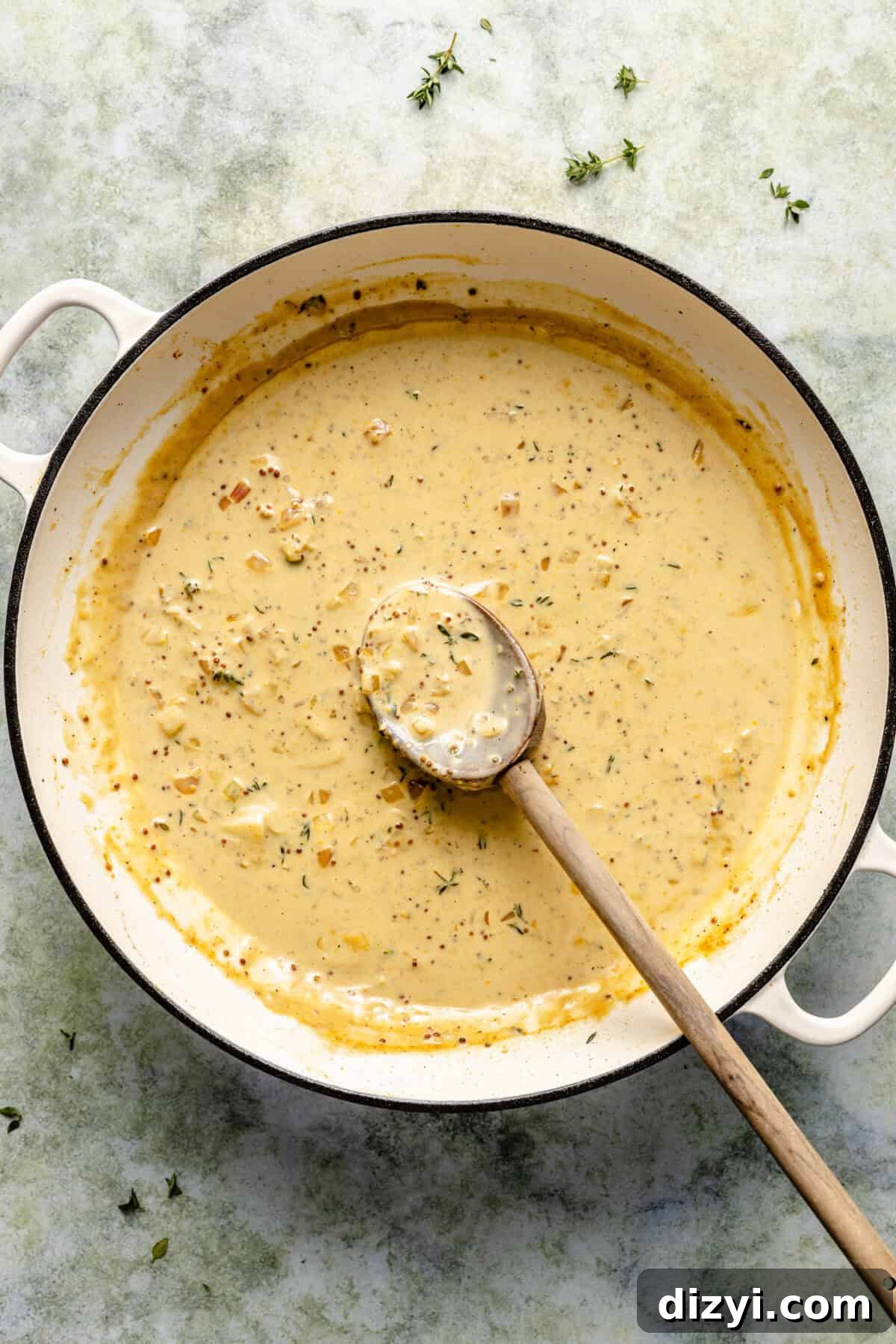 Creamy Mustard-White Wine Sauce in cast iron skillet.