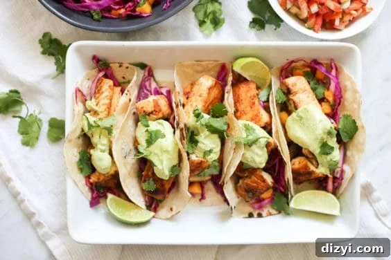 baja fish tacos with mango coleslaw and avocado crema