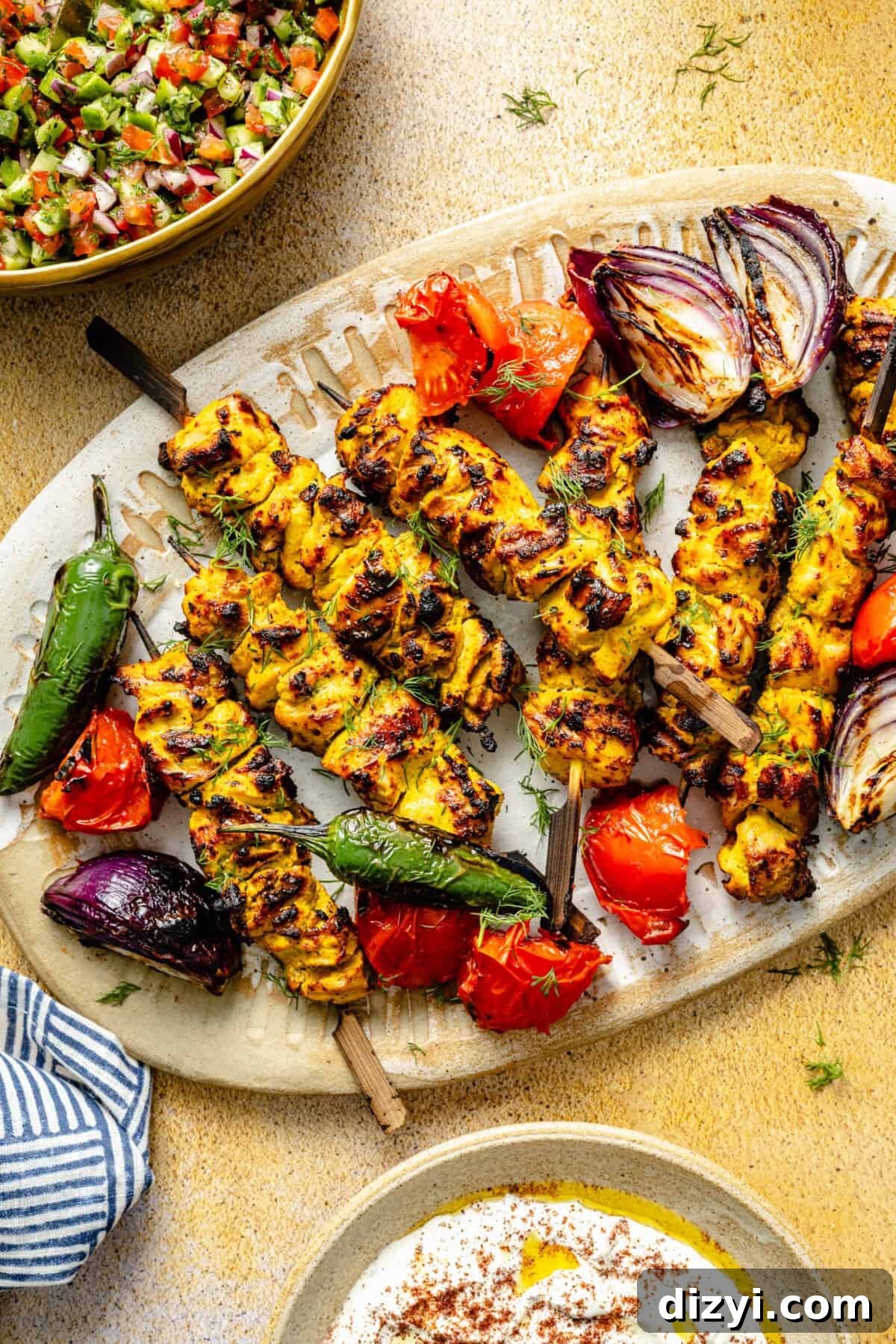 Father's Day Dinner Ideas Dad Will Love 2 Persian-Inspired Chicken Kebabs on a platter with veggies.