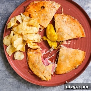 Sliced Grain-Free Reuben Quesadilla served on a board
