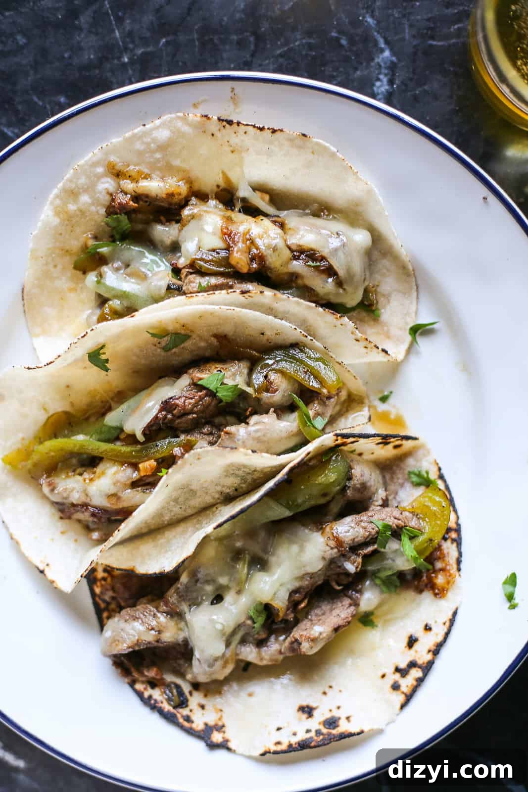Philly Cheesesteak Tacos Recipe: Cheesy Steak Tacos 2 Philly Cheesesteak Tacos with ribeye, peppers and melted provolone