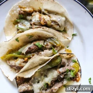 Philly Cheesesteak Tacos Recipe: Cheesy Steak Tacos 5 Close-up of Philly cheesesteak taco filling