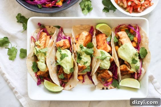 baja fish tacos with mango coleslaw and avocado crema