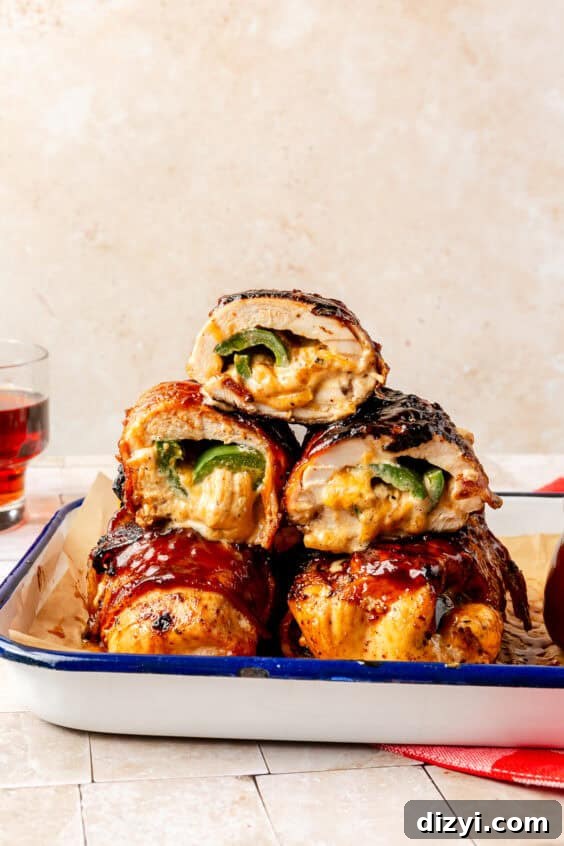 Grilled Jalapeño Popper Chicken stacked on top of one another.