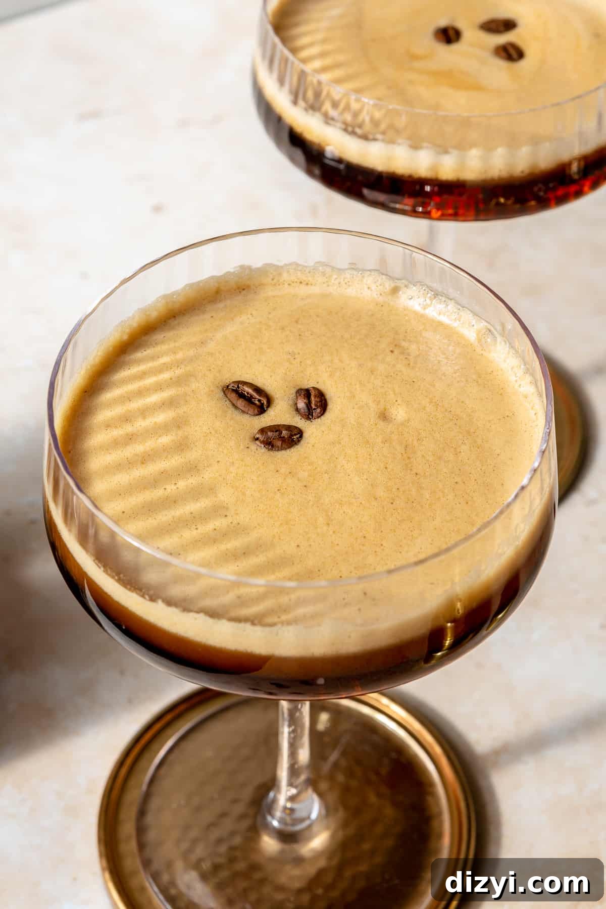 Close up of espresso martini. Another glass in the background.