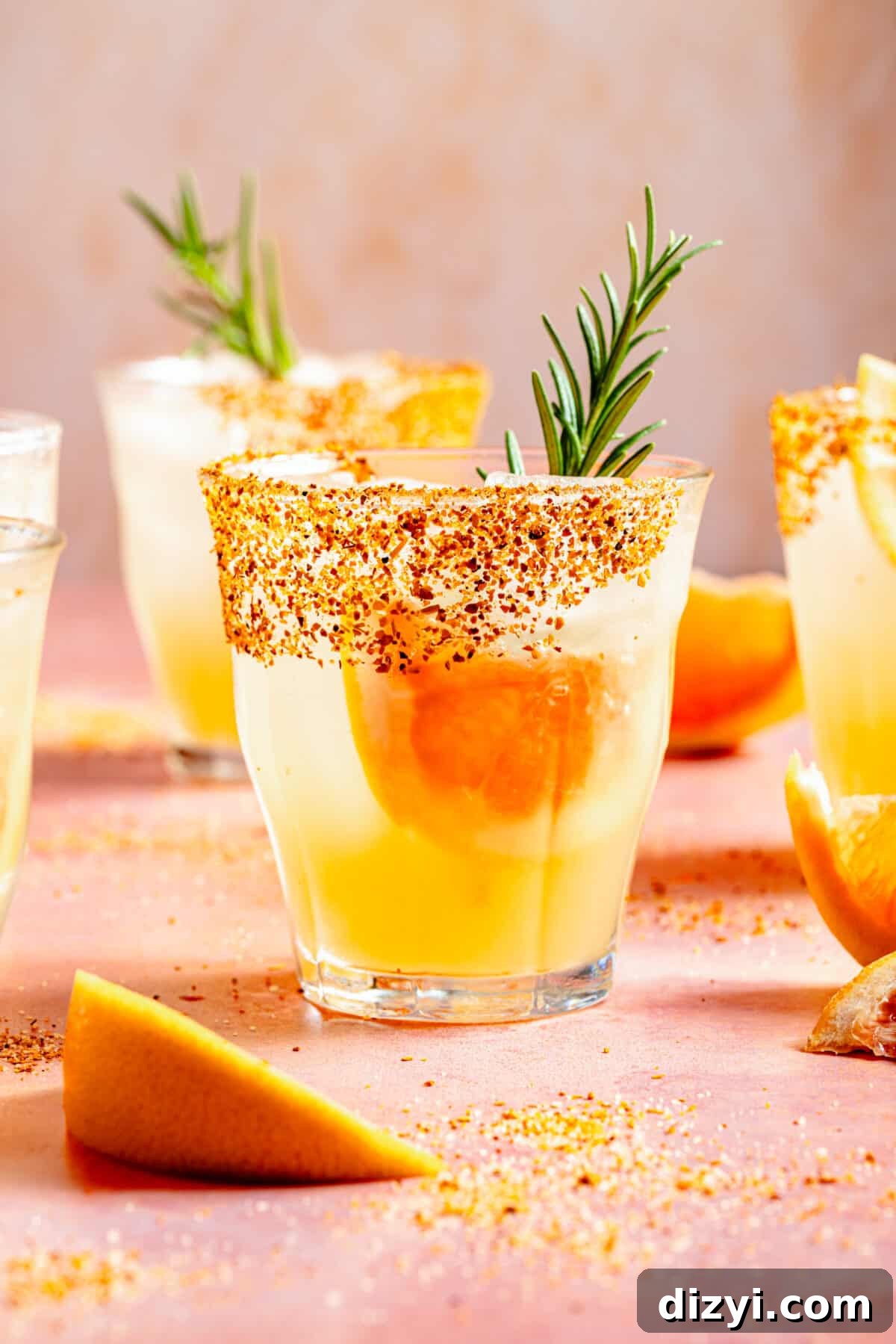 Skinny Rosemary Paloma in low glass with grapefruit and rosemary garnish.