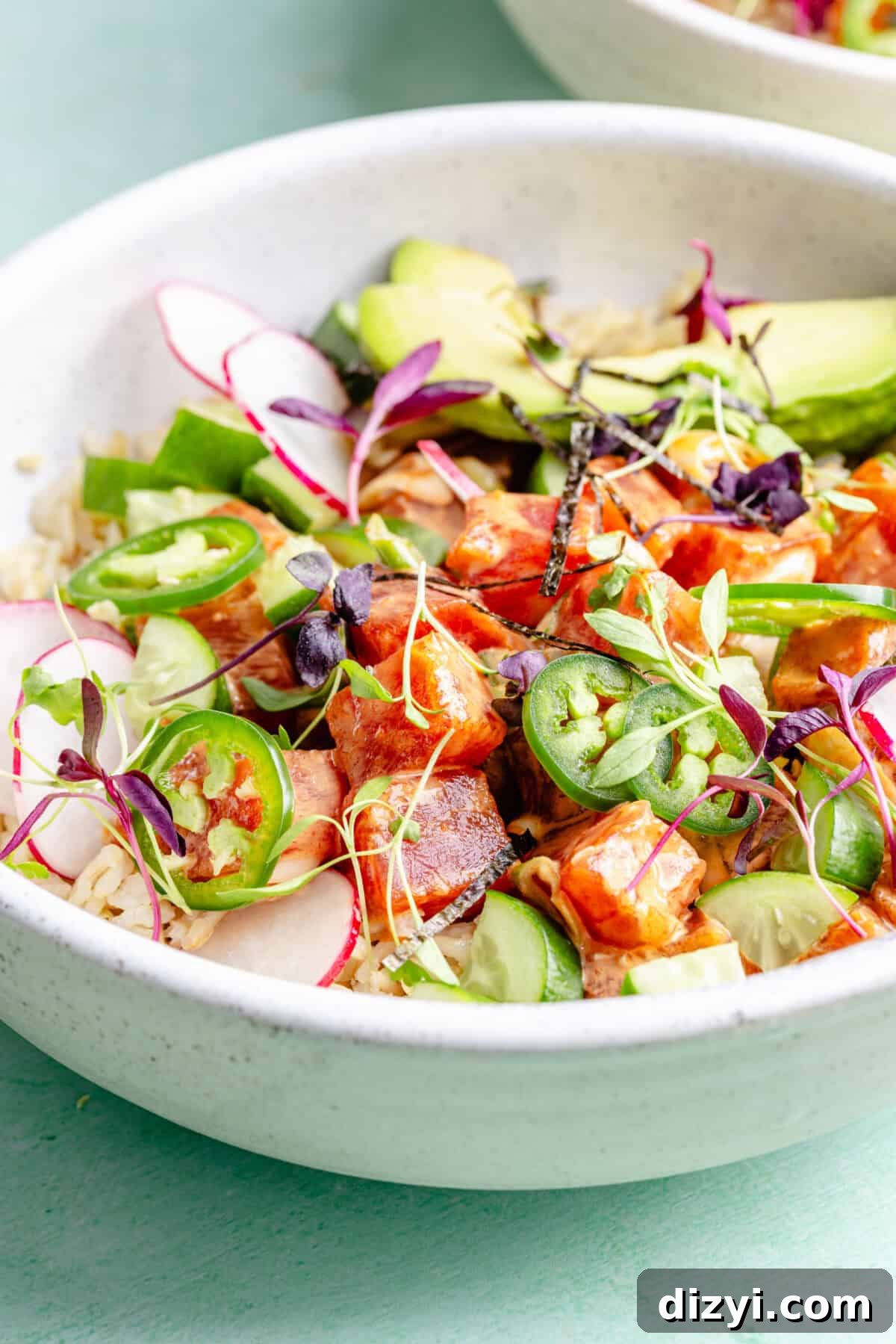 Spicy Hawaiian Ahi Poke Bowl Recipe 3 Close up of Hawaiian-Inspired Spicy Tuna Poke in bowl.