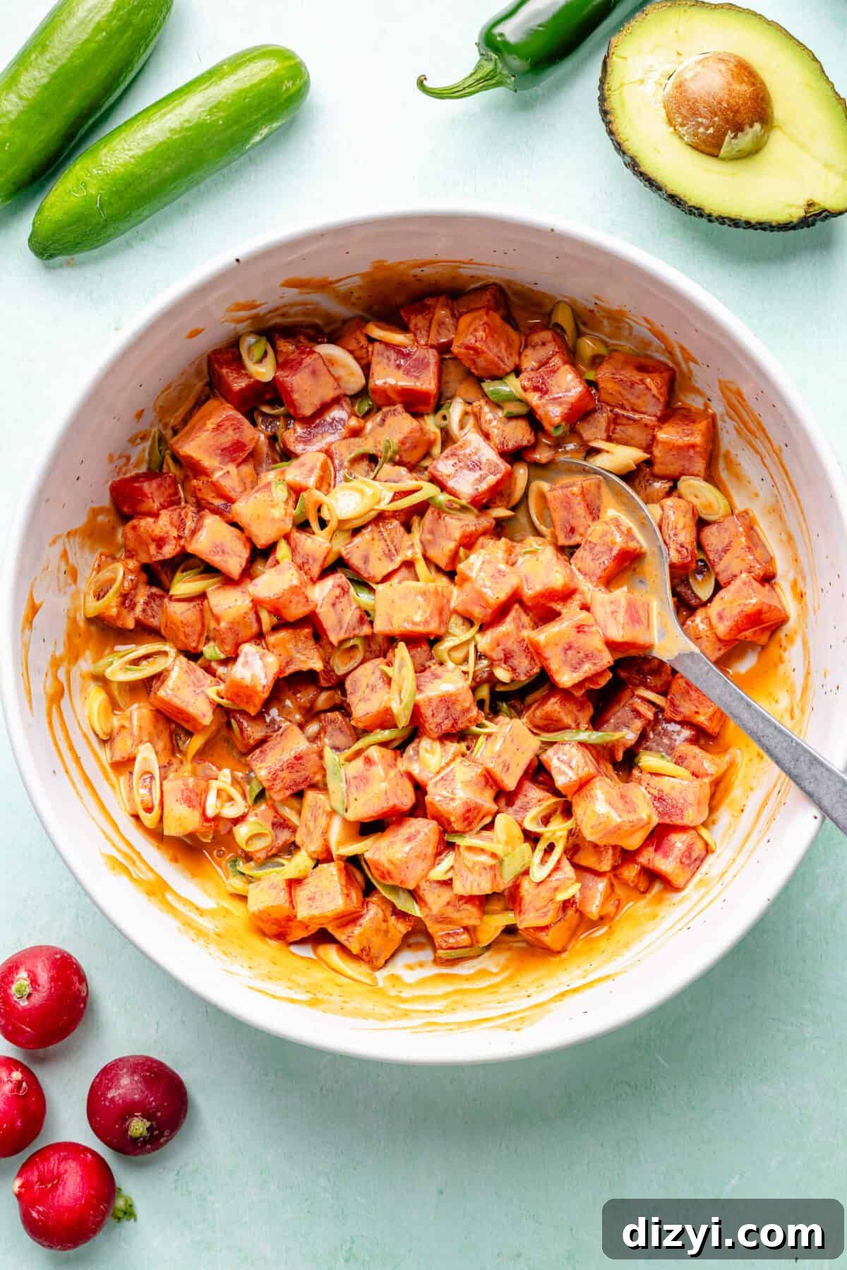 Spicy Hawaiian Ahi Poke Bowl Recipe 6 Hawaiian-Inspired Spicy Tuna Poke mixed in bowl.