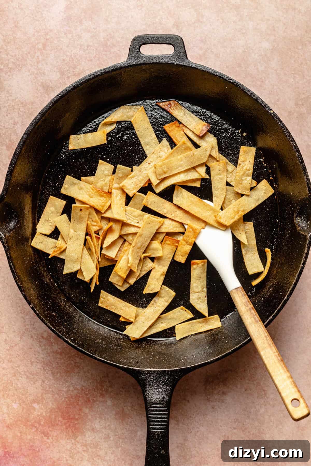 Tex-Mex Migas: Eggs, Salsa and Crispy Tortilla Chips 4 Tortilla strips crisping in cast iron skillet.