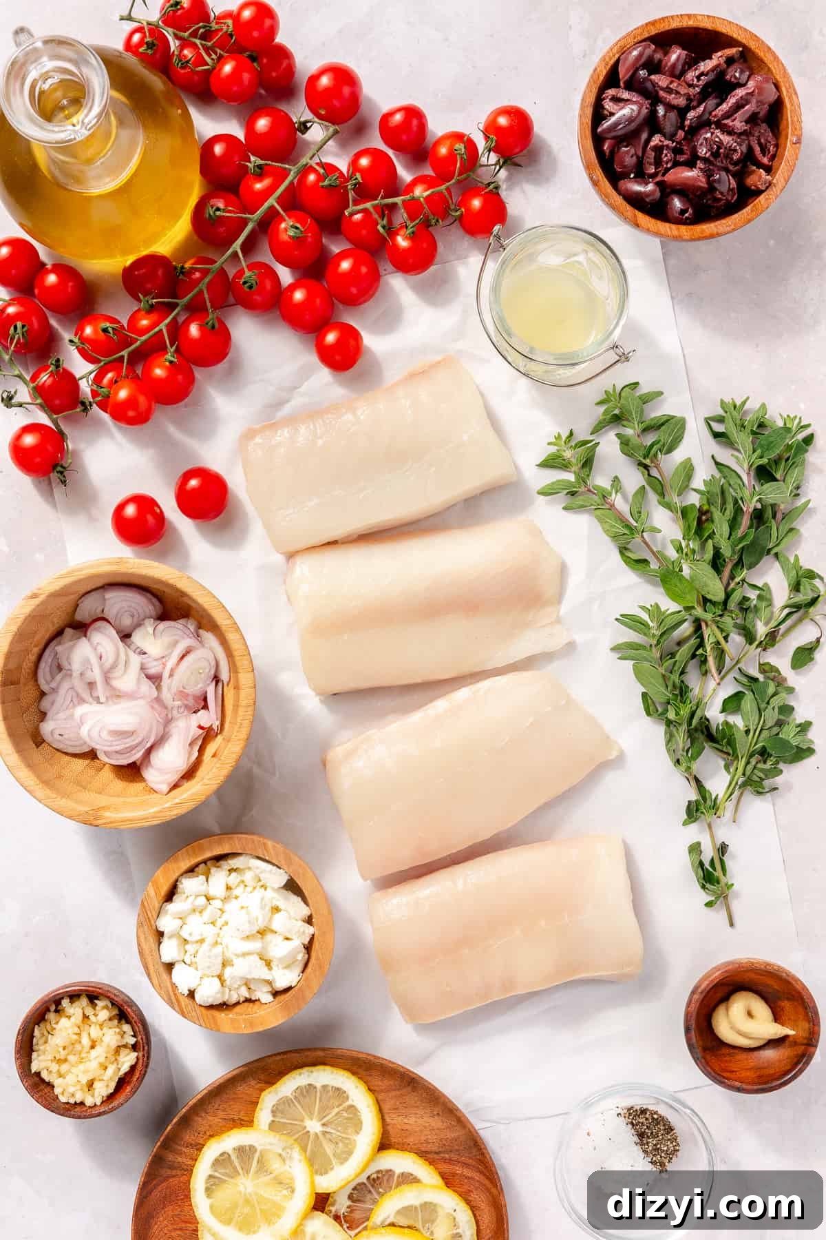 Oven-Baked Greek-Inspired Halibut ingredients scattered on counter.