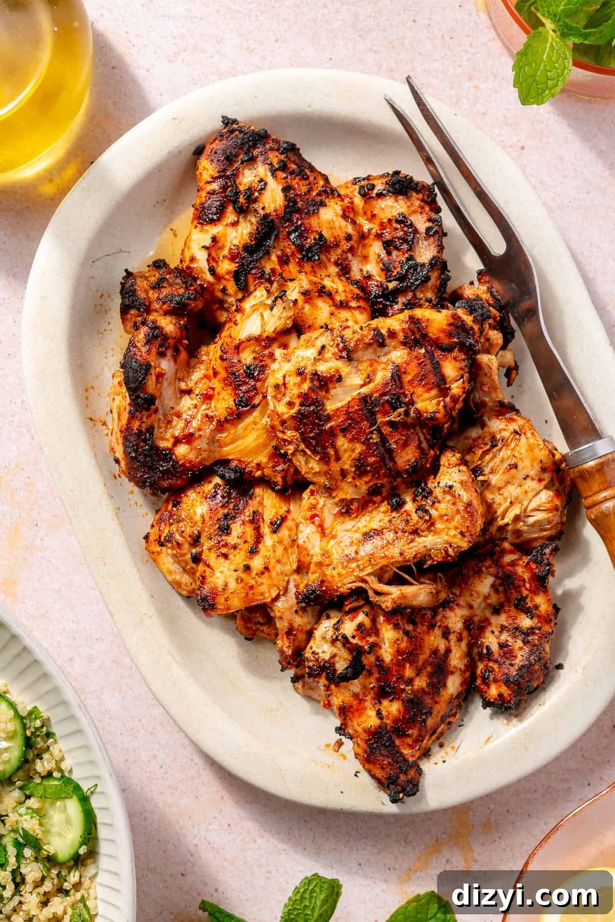 Grilled chicken on large platter.