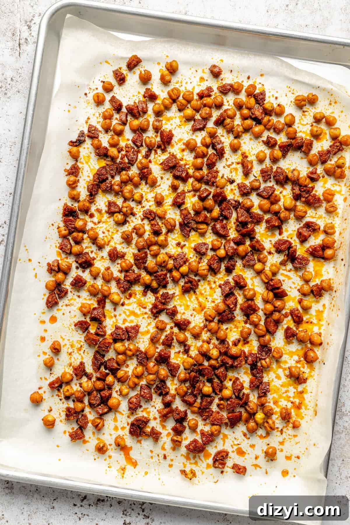 Mexican Chopped Salad with Avocado and Cilantro-Lime Dressing 3 A parchment paper-lined baking tray of roasted chickpeas and chorizo