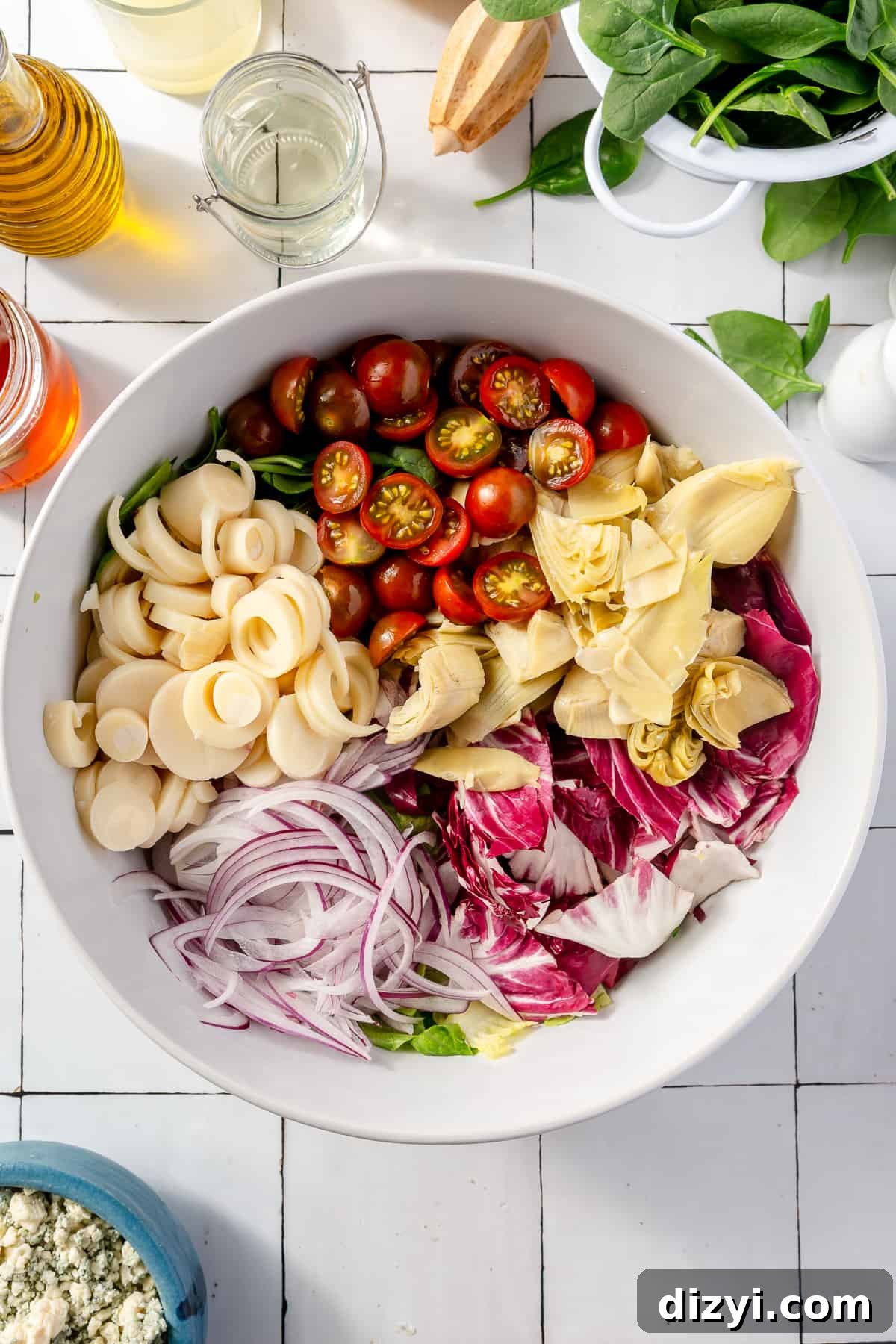Steakhouse Chopped Salad ingredients in large white bowl.