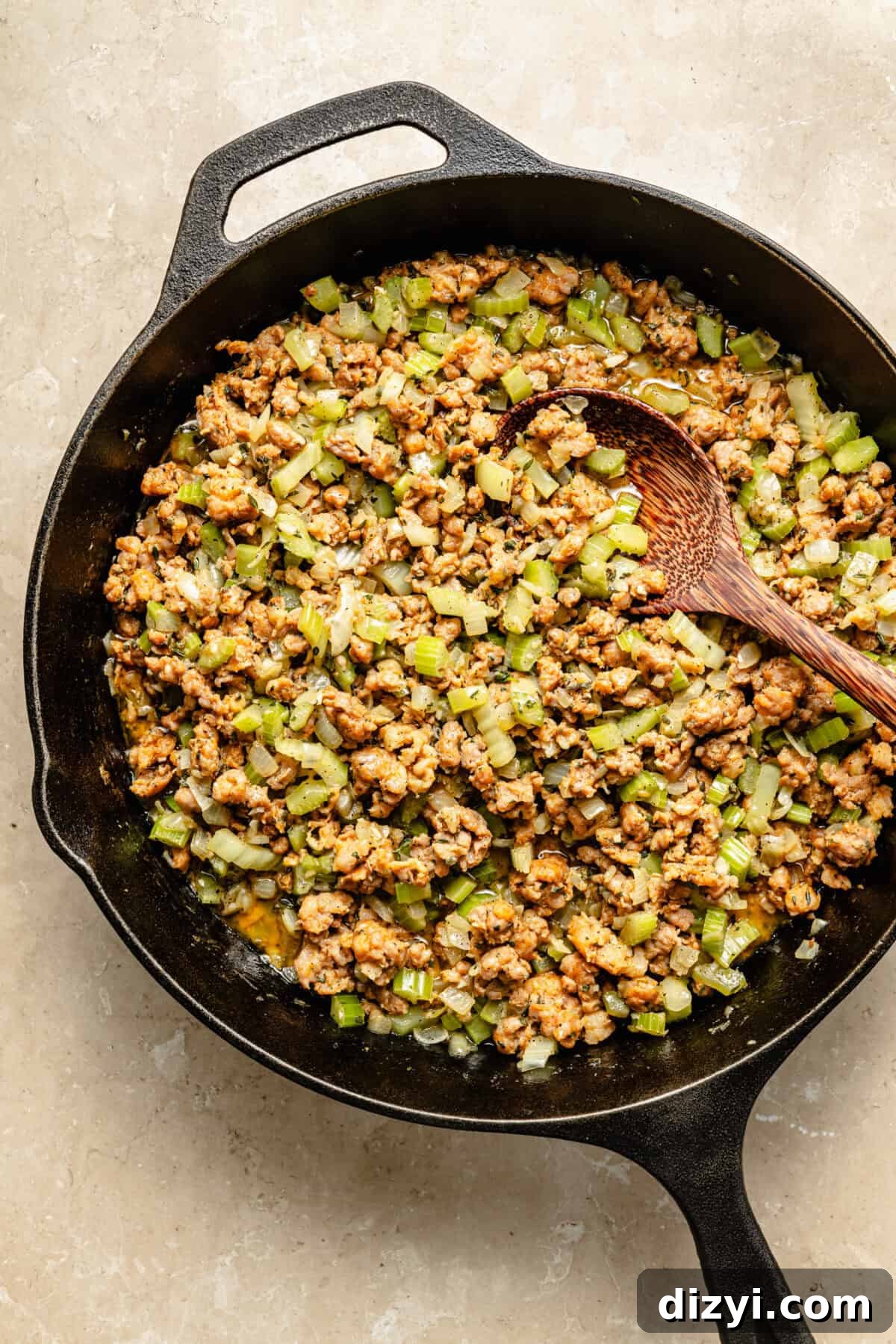 Oven-Baked Sausage and Sage Stuffing 4 a large cast-iron skillet with crumbled sausage, sautéed celery, and onions