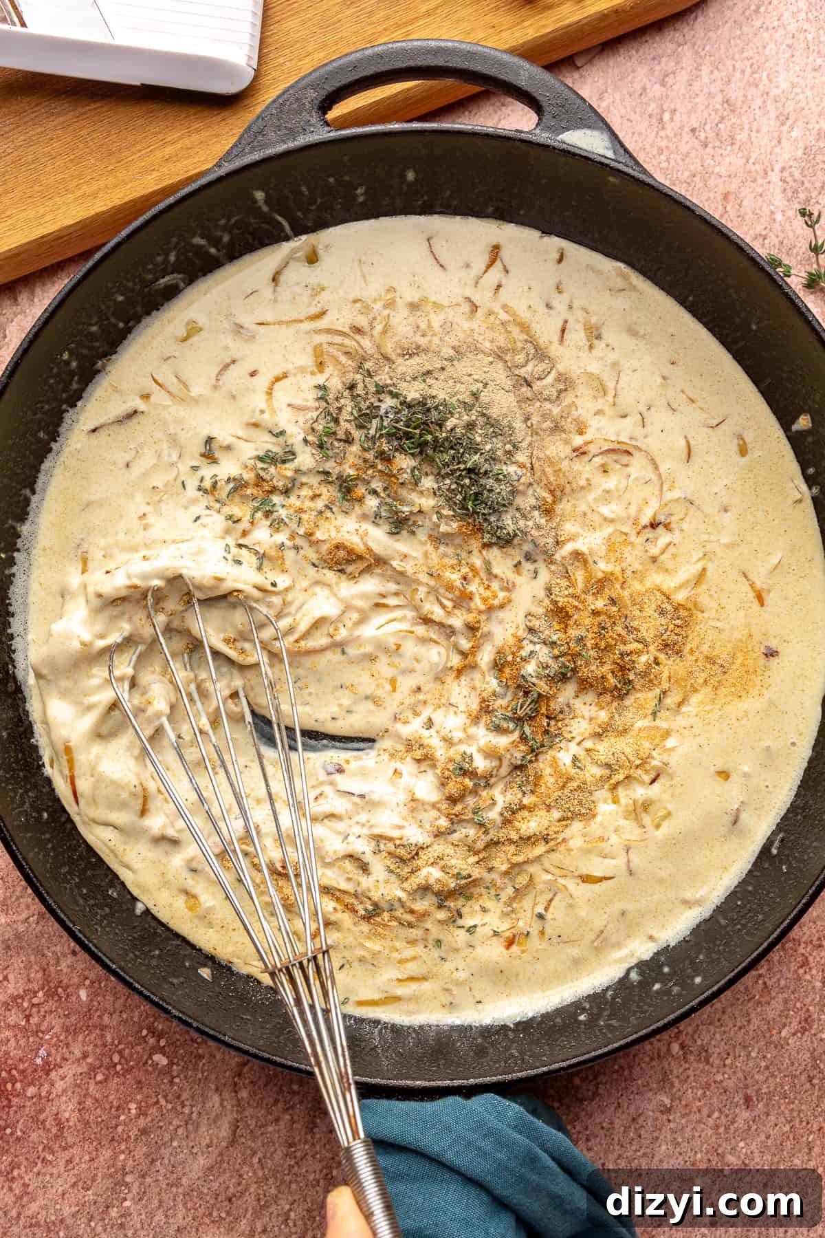 Creamy Scalloped Potatoes with Caramelized Onions 6 Sauce for the Caramelized Onion Scalloped Potatoes in a large skillet. Whisk resting in skillet.