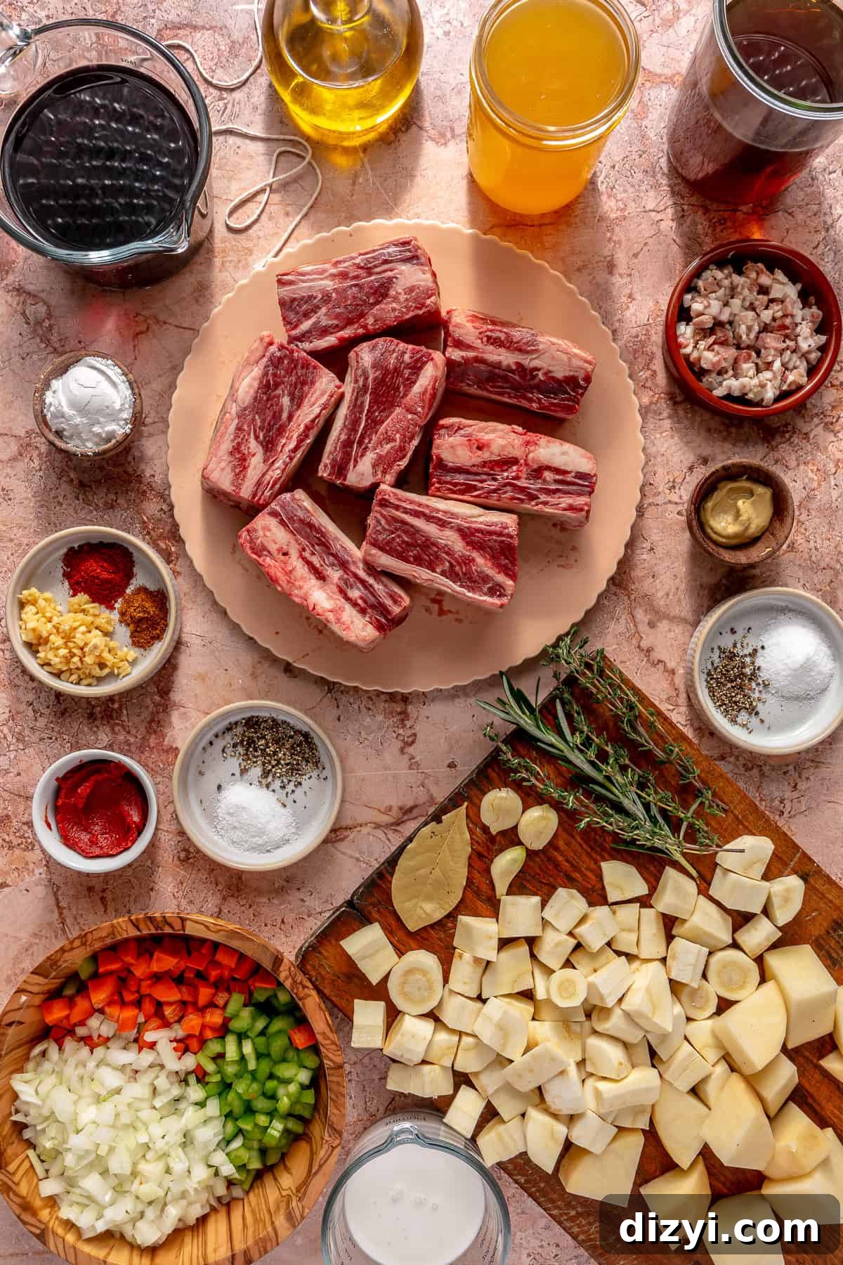 Braised Short Ribs in Red Wine with Parsnip-Potato Mash Recipe 3 All of the ingredients needed for Red Wine Braised Short Rib and Parsnip Potato Mash on a pink countertop.