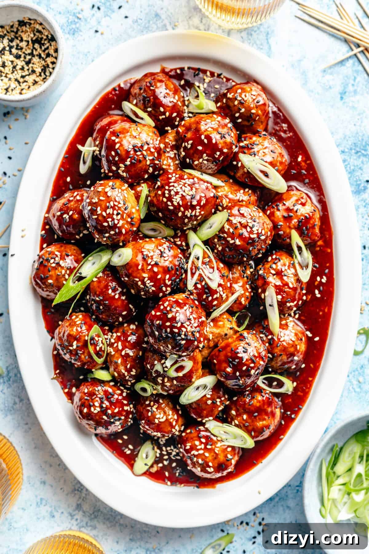 Korean-Inspired BBQ Chicken Meatballs on white oval platter.