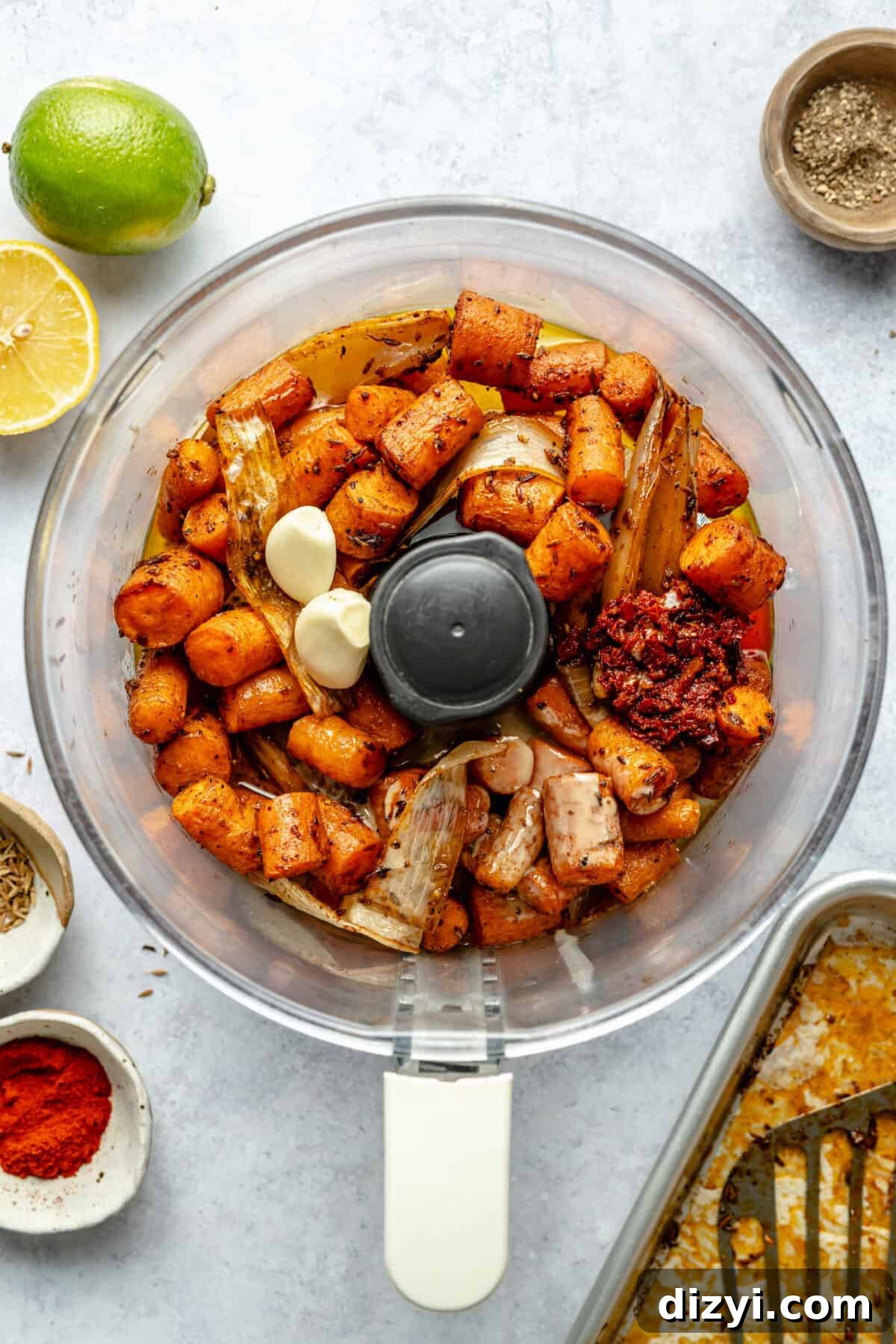 Roasted carrots, shallot, garlic, and spices in food processor. Not blended.