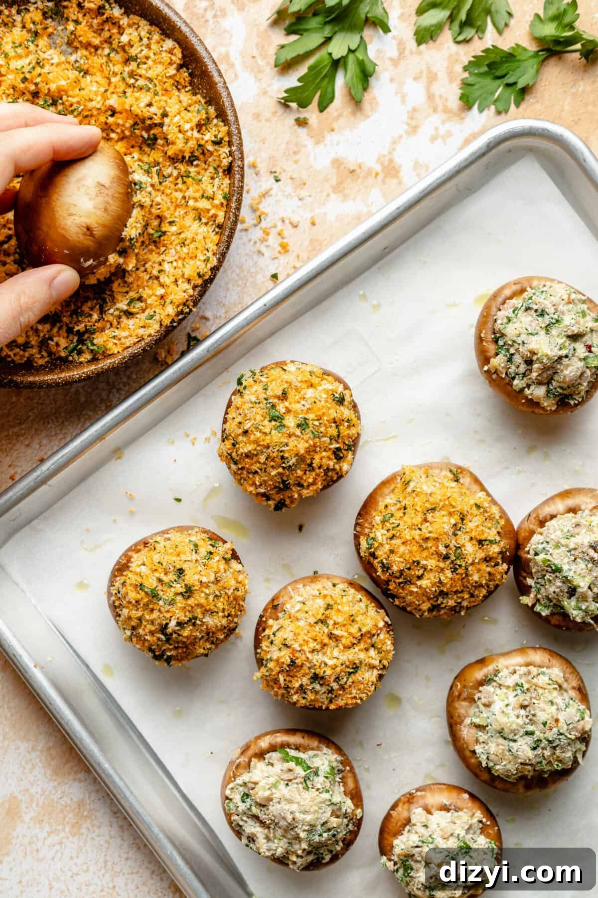 Sausage Stuffed Mushrooms with Garlic and Parmesan 6 Mushrooms in process of being filled and adding panko to the top.