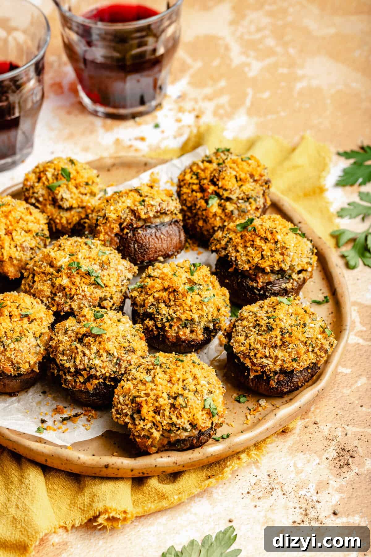 Sausage Stuffed Mushrooms with Garlic and Parmesan 7 Sausage Stuffed Mushrooms on plate. Glass of red wine in background.