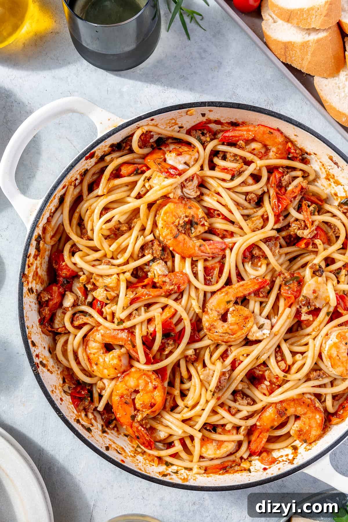 Pasta tossed with sauce and all of the seafood.