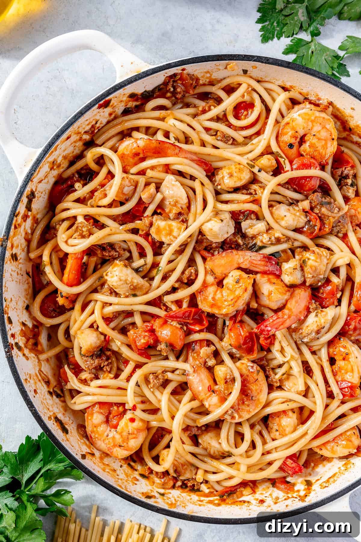 Pasta tossed with sauce and all of the seafood.