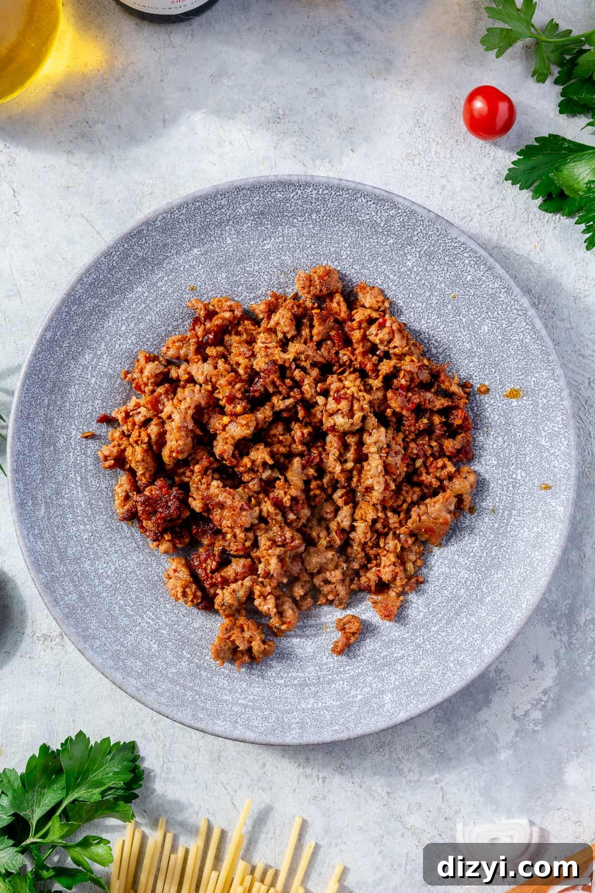 Browned sausage on a blue plate.