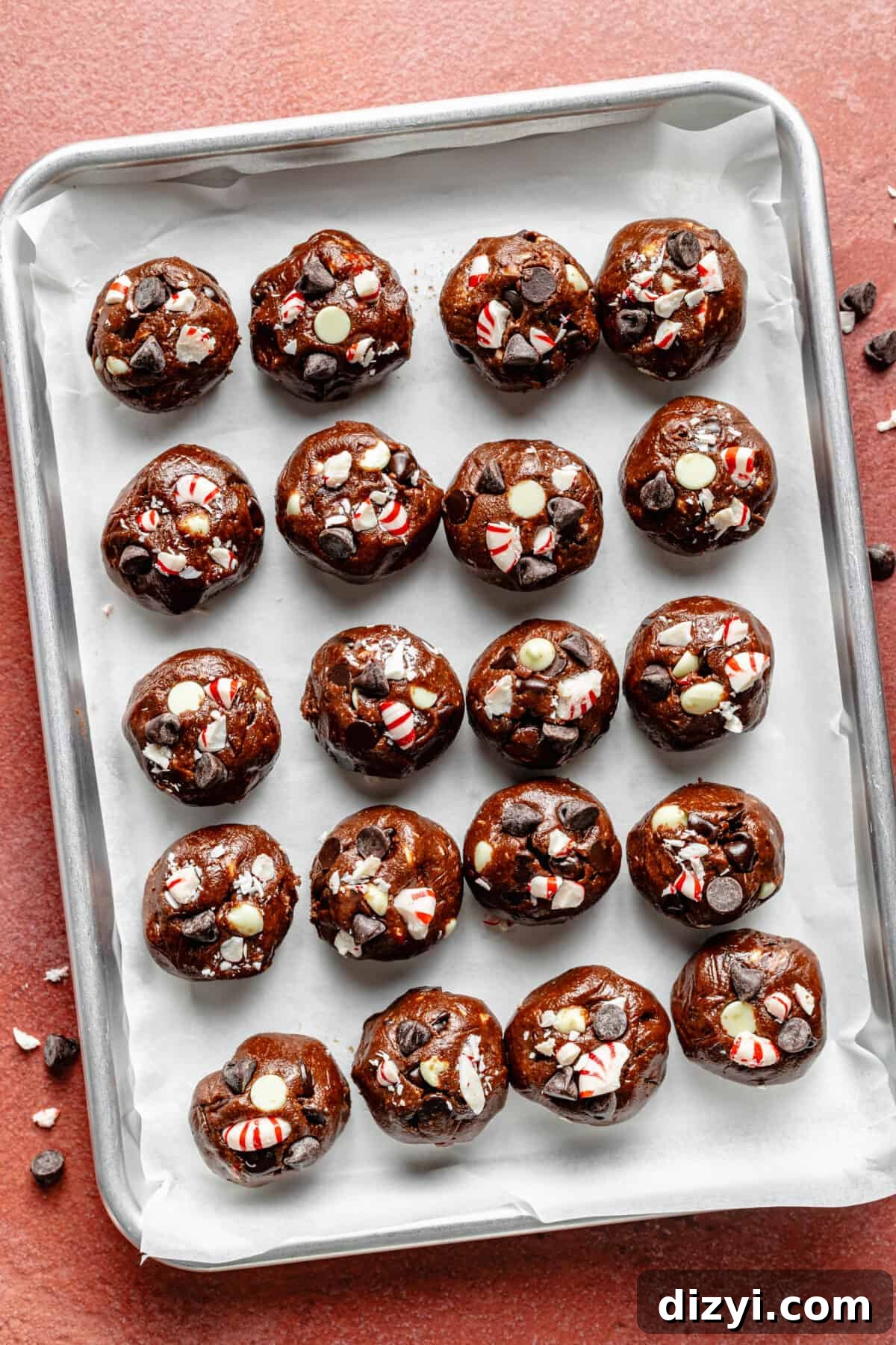 Double Chocolate Peppermint Cookie dough rolled into balls on sheet pan.