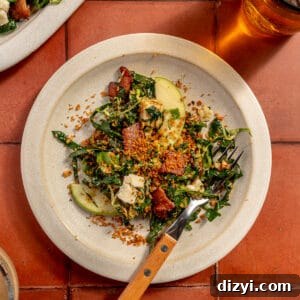Bacon Brussels Crunch Salad on white plate. Platter peeking in.
