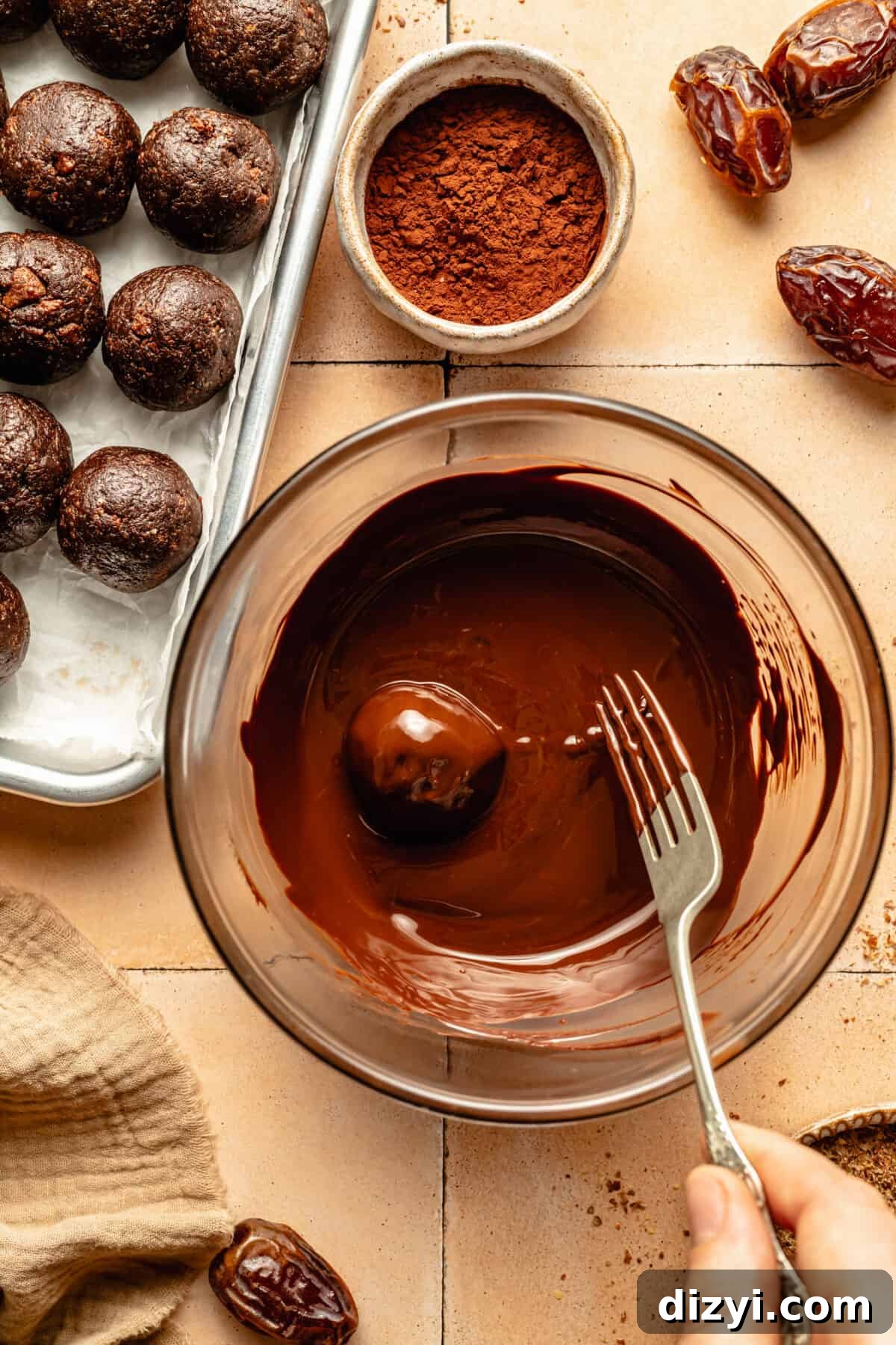 Thin Mint Energy Bite in bowl of melted choclate.
