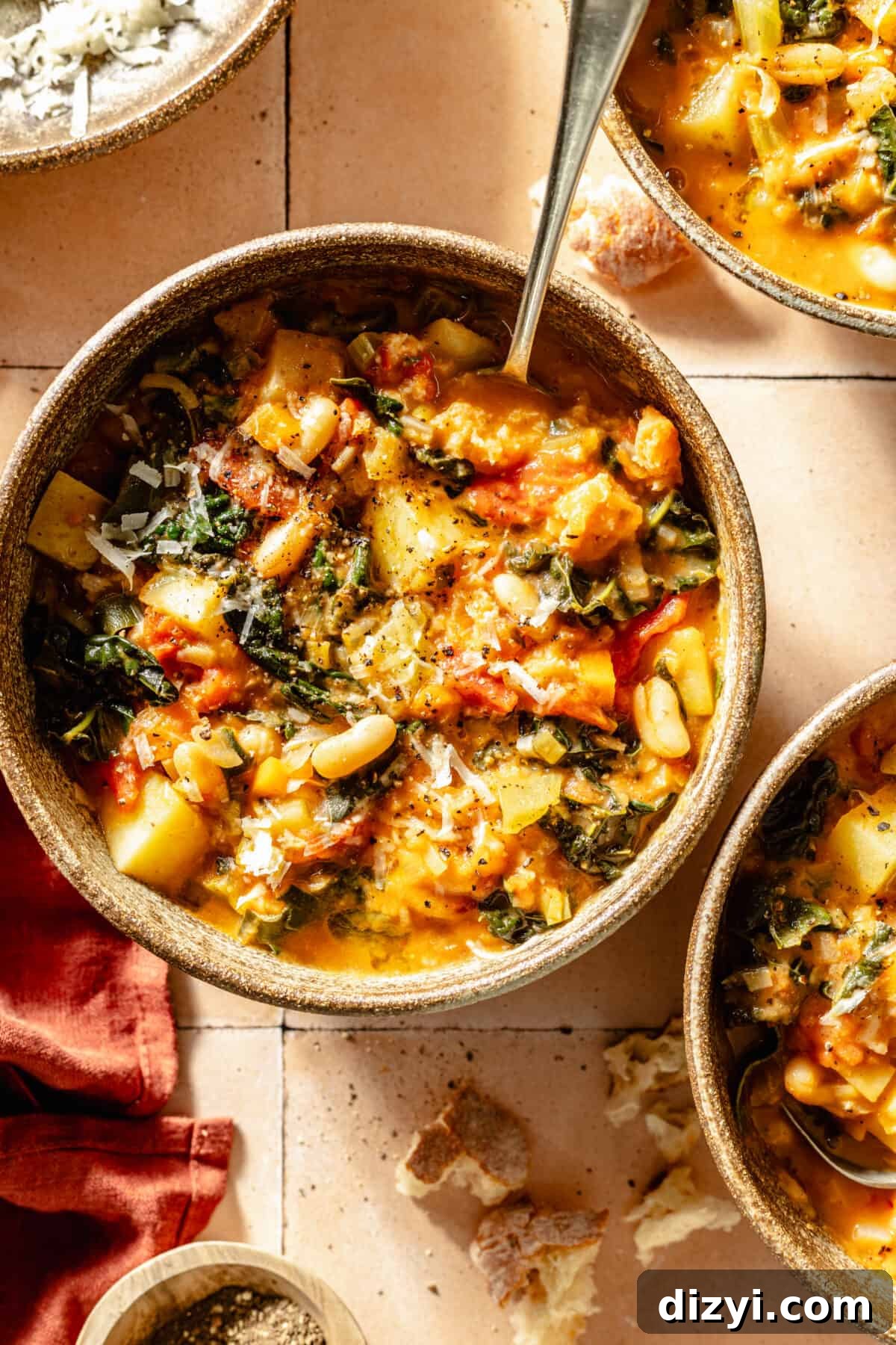 Tuscan Ribollita in bowls on tile background.
