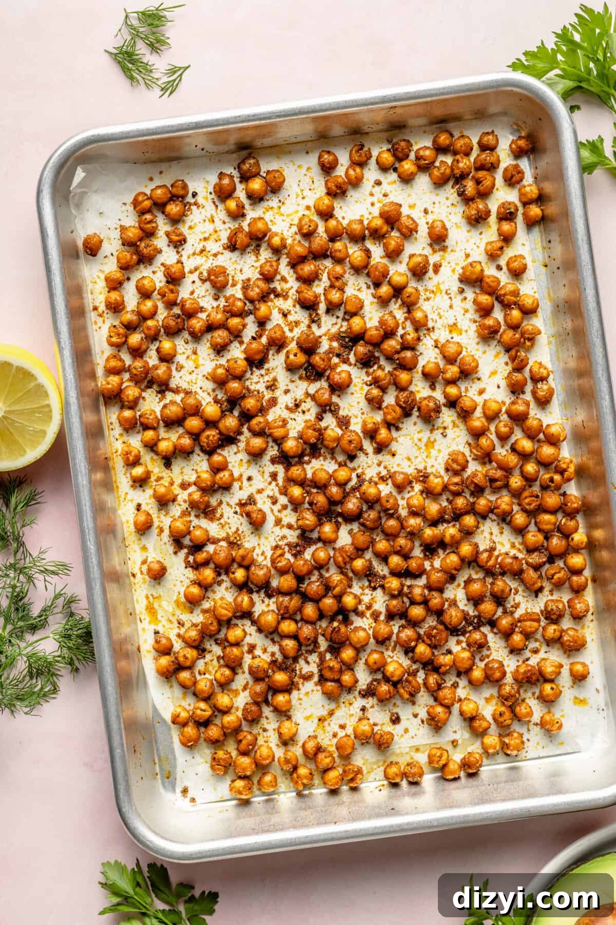 Crispy chickpeas on parchment lined sheet pan.