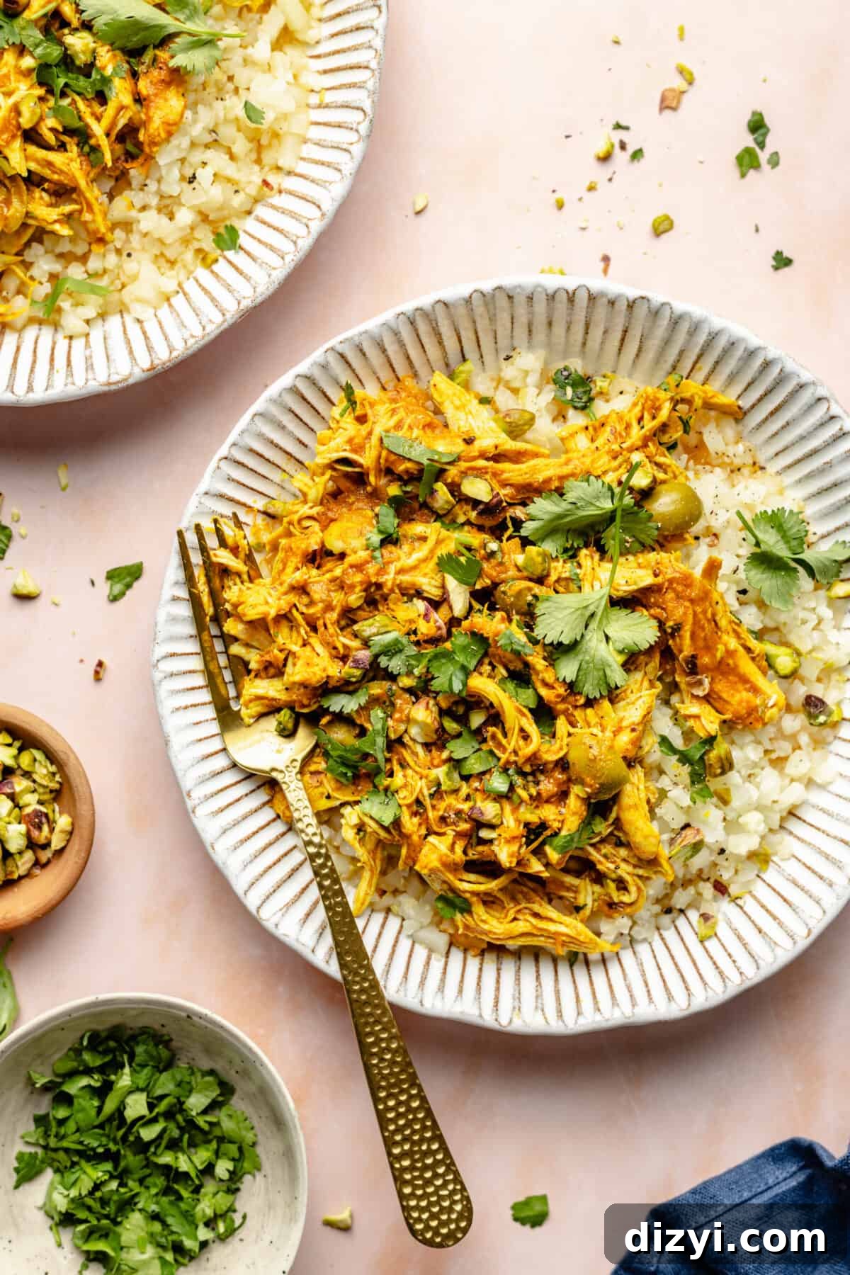 Slow Cooker Chicken Tagine plated in low white bowls.