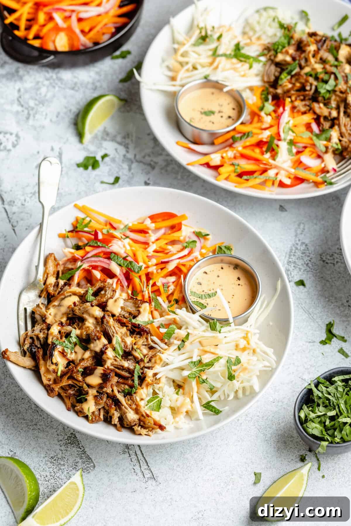 Slow Cooker Lemongrass Shredded Pork Bowls 7 Slow Cooker Shredded Lemongrass Pork Bowls in white bowls. Blue napkin ticked behind.