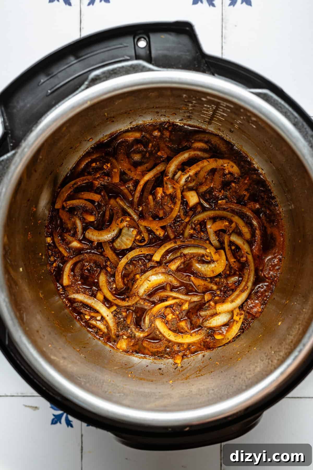 Instant Pot Greek Shredded Beef Bowls 4 Onions, garlic, and other seasonings in Instant Pot.