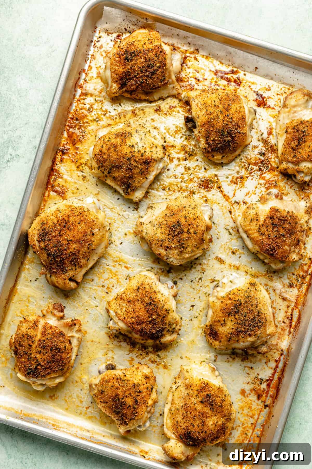 Crispy chicken thighs on sheet pan.