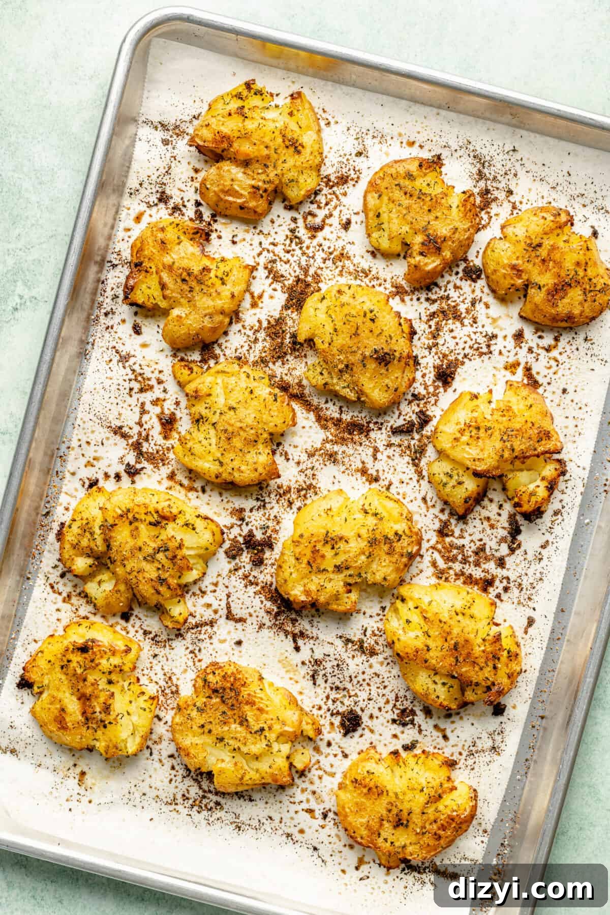 Smashed potatoes on sheet pan.