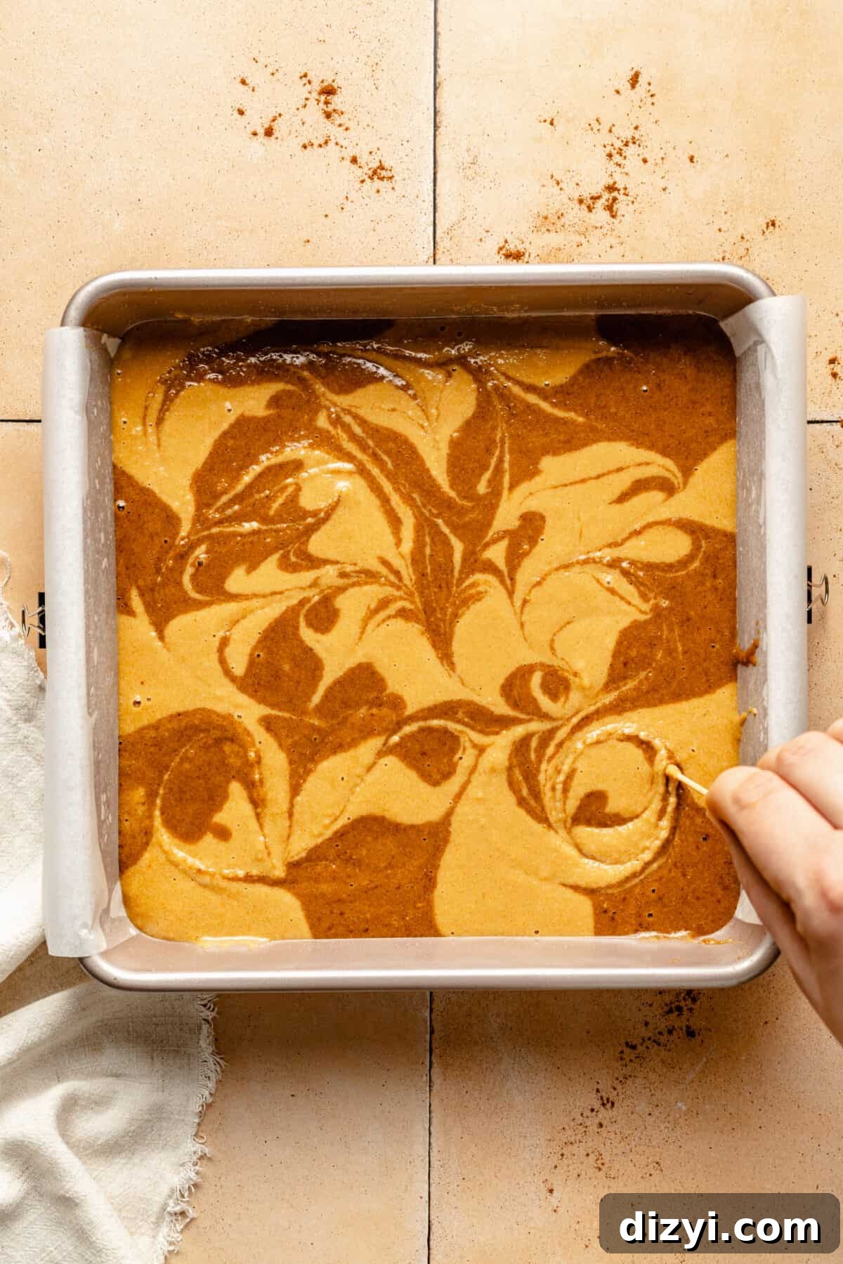 Paleo Cinnamon Swirl Cake batter swirled in pan.